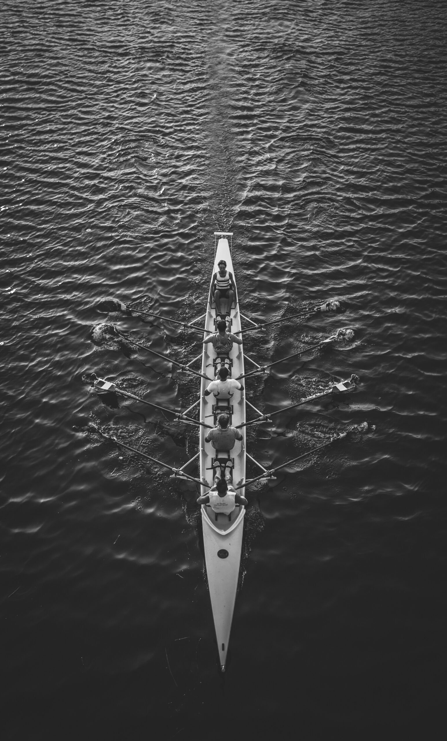 people riding boat on body of water